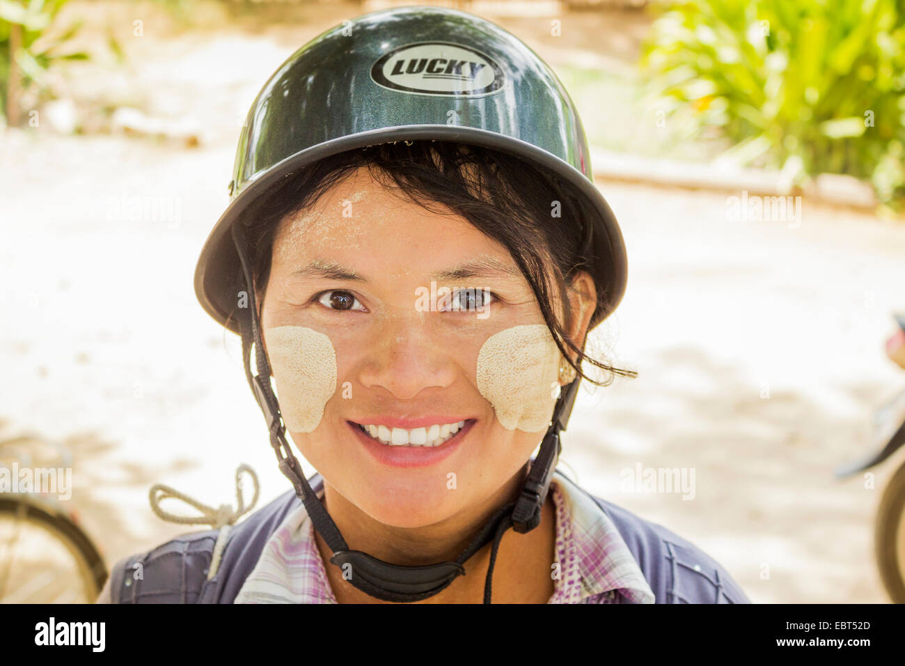 Smiling young woman wearing helmet hi-res stock photography and images ...