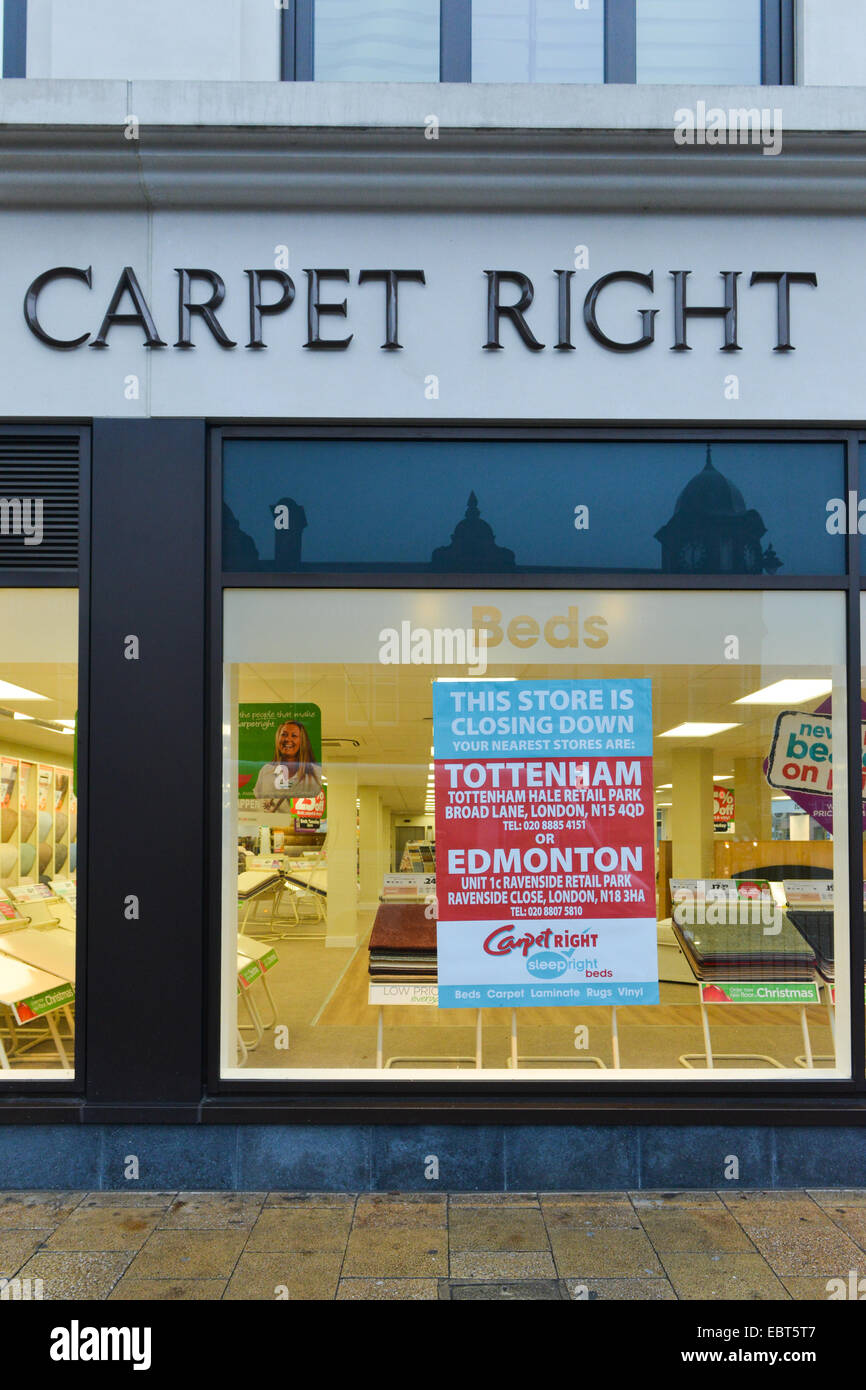 Tottenham, London, UK. 4th December 2014. Carpetright is closing the Tottenham store that was burned down