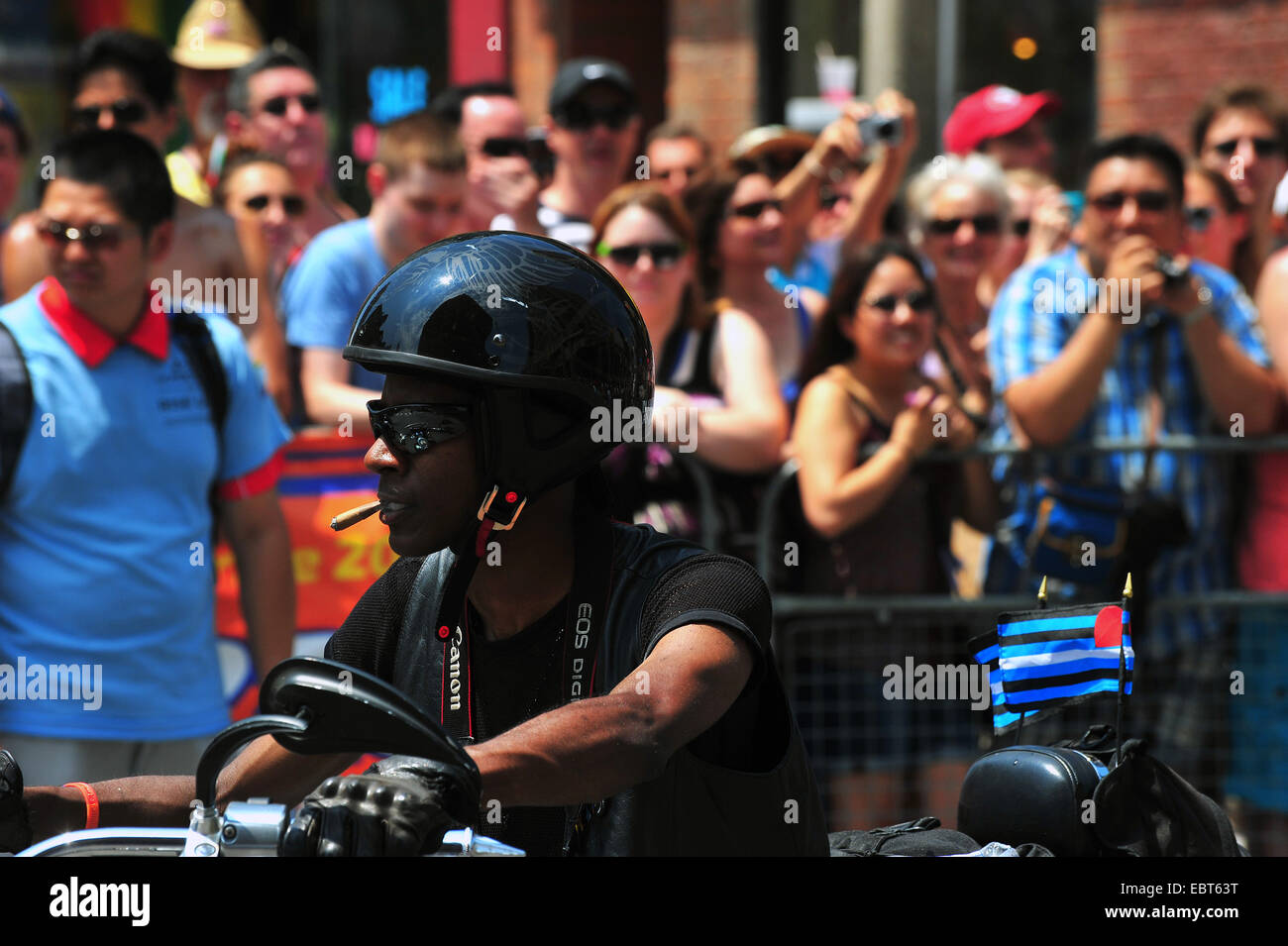 A biker with a cigar at the 2014 World Pride in Toronto. Stock Photo