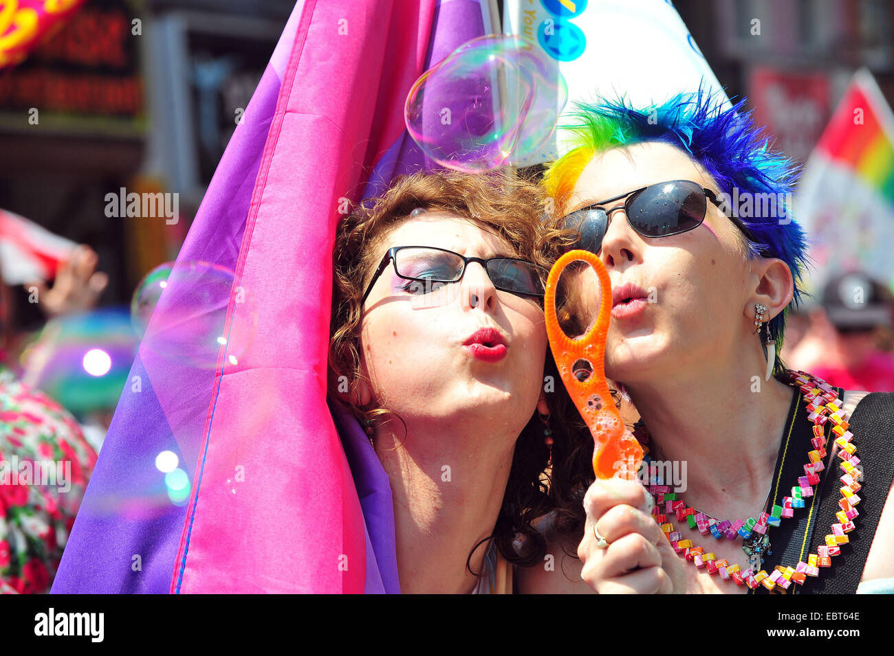 Woman pose to blow bubbles at the 2014 World Pride in Toronto. Stock Photo