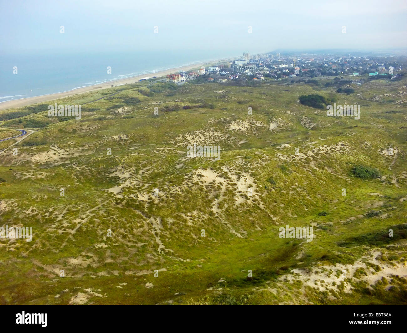 aerial view to grass-grown dune landscape at the North Sea Coast, Nordwijk aan Zee in background, Netherlands, Coepelduynen, Noordwijk aan Zee Stock Photo