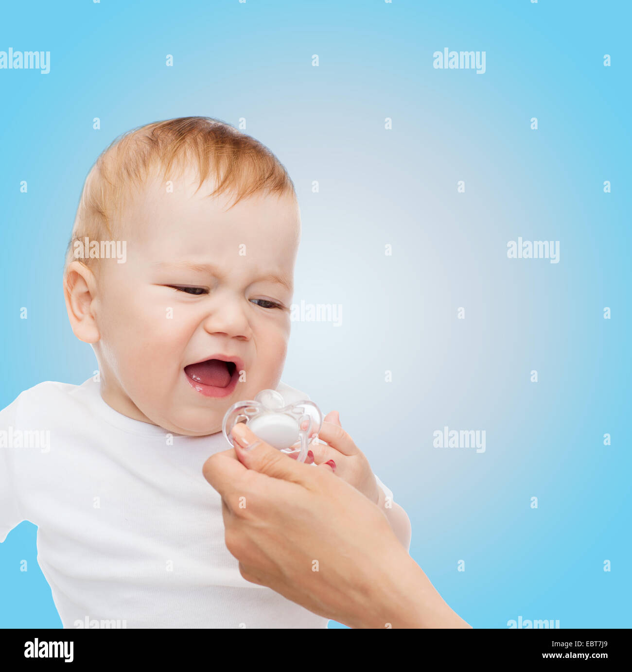 crying baby with dummy Stock Photo Alamy