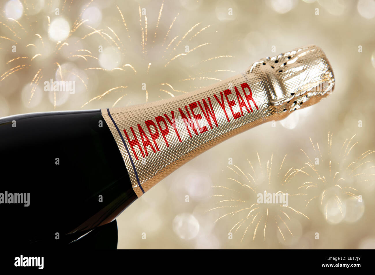 Happy New Year written on champagne bottle Stock Photo
