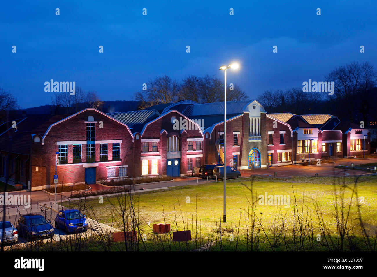 illuminated Flottmann-Hallen in twilight, Germany, North Rhine-Westphalia, Ruhr Area, Herne Stock Photo