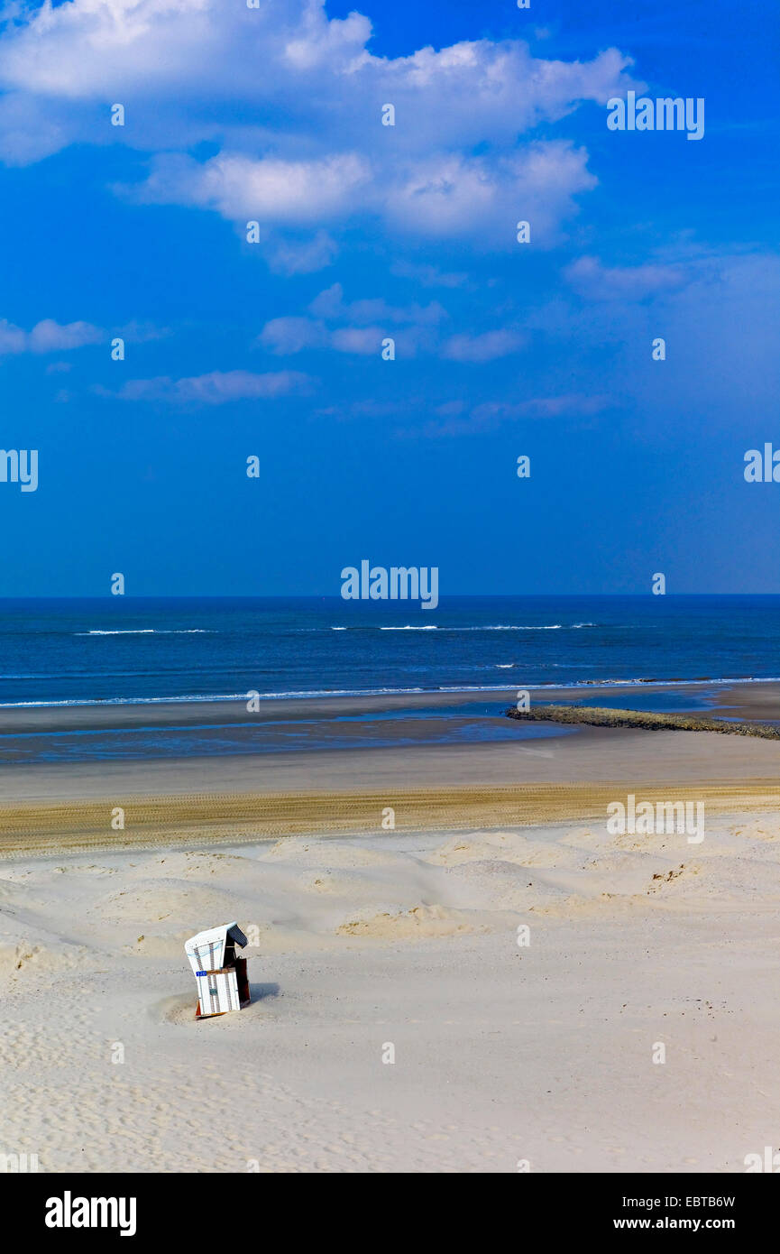 lone roofed wicked beach chair on sandy beach, Germany, Lower Saxony, Wangerooge Stock Photo