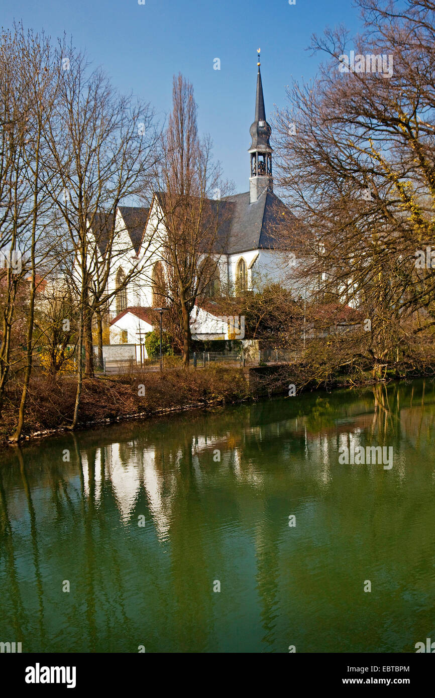 Bruederkirche mirrored in river Lippe in spring, Germany, North Rhine-Westphalia, Lippstadt Stock Photo
