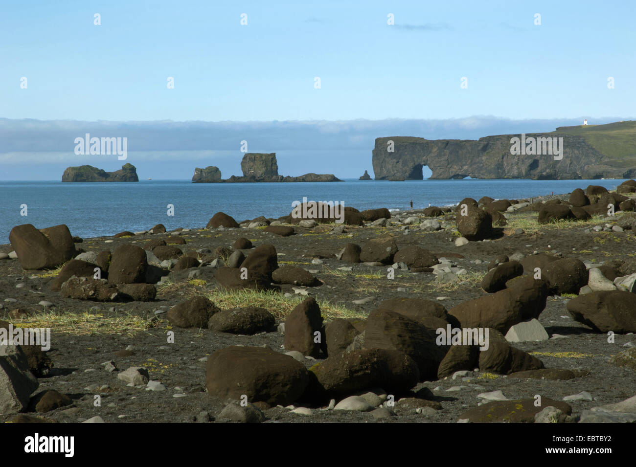 view from a boulder beach at Cape Dyrholaey and the North Atlantic Ocean, Iceland Stock Photo