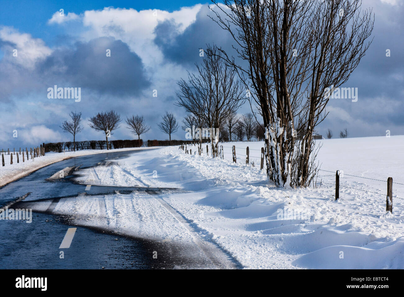 snow bank on country road, Belgium, Ardennen Stock Photo