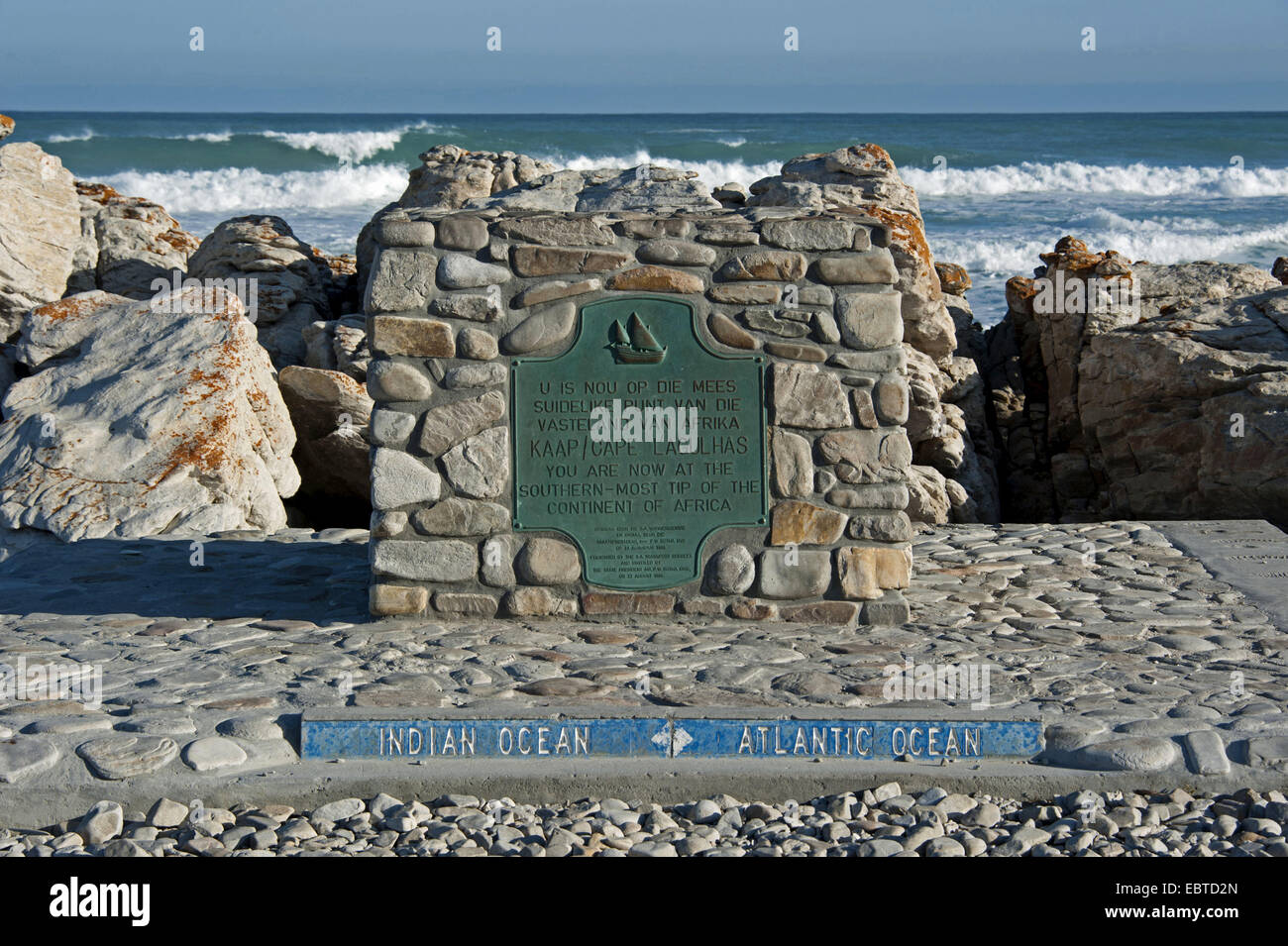 boundary stone marking the border between the Atlantic and the Indian Ocean at Cape Agulhas, the most southerly place in Africa, South Africa, Western Cape, Cape Agulhas National Park Stock Photo