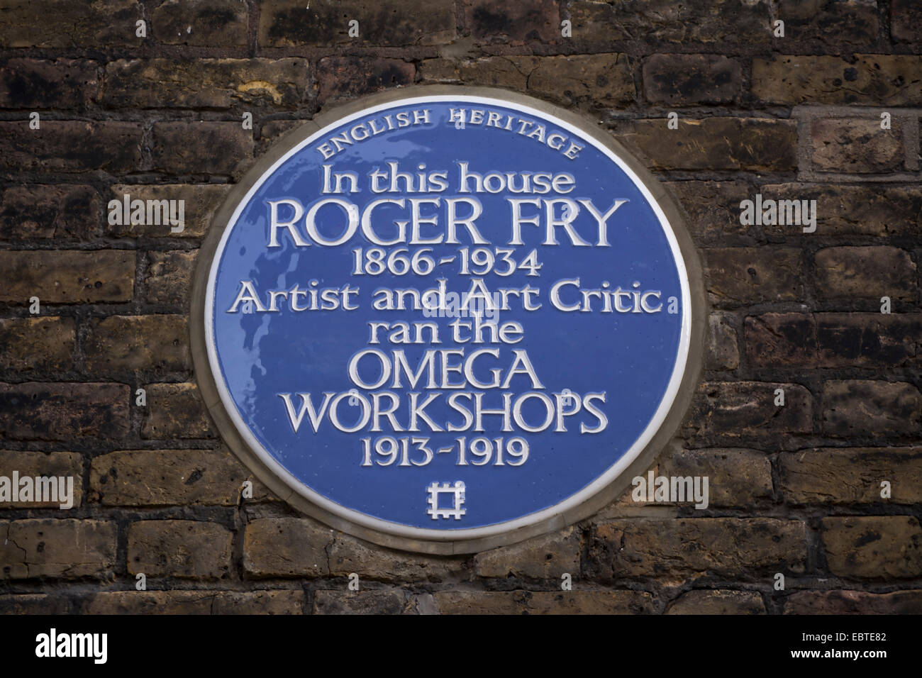 english heritage blue plaque marking the site of artist roger fry's omega workshops, fitzroy square, london, england Stock Photo