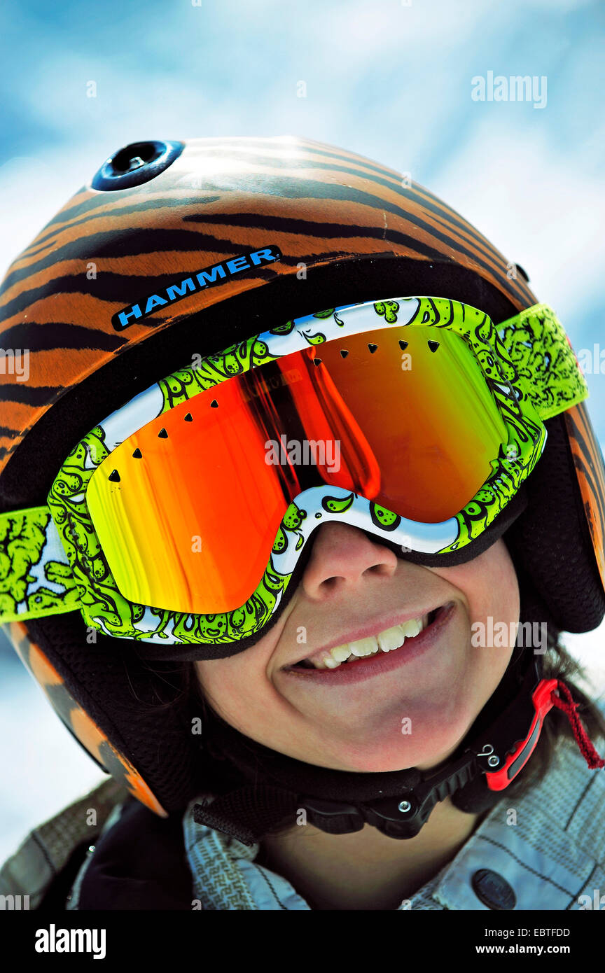 smiling boy wearing a skiing helmet and a skii goggle, France Stock