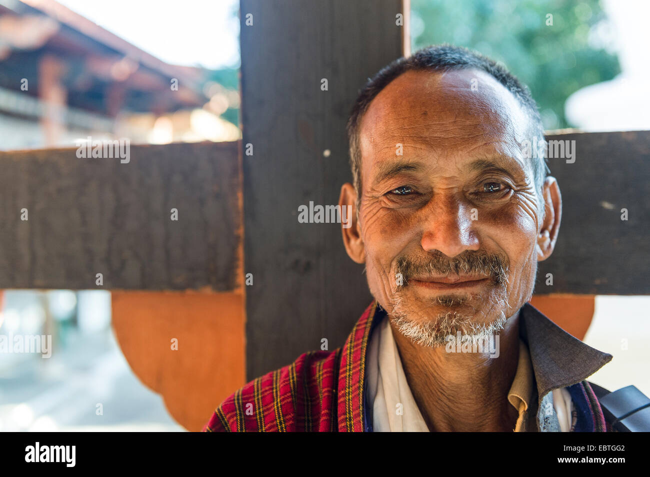 Portrait of Farmer, Punakha Dzong wearing national dress and official scarf, Bhutan Stock Photo