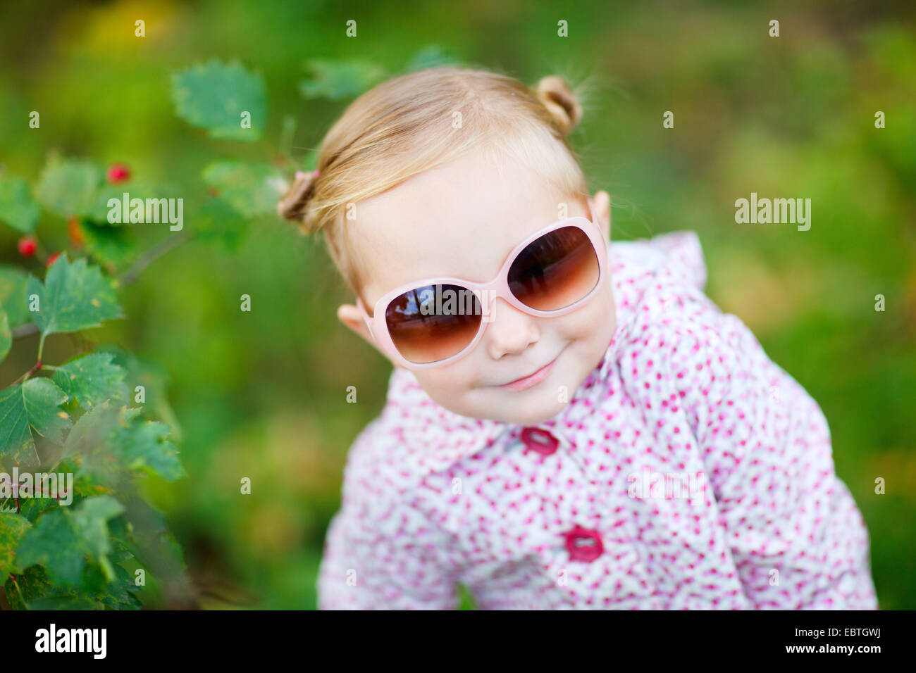 cute little girl with sunglasses in a park Stock Photo - Alamy