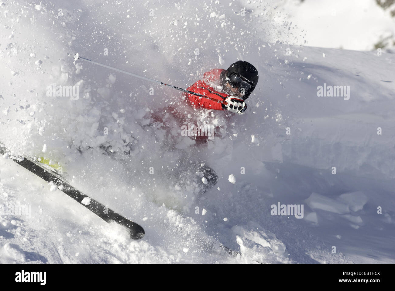 female skier falling at full speed, Austria, Salzburg, Obertauern Stock Photo