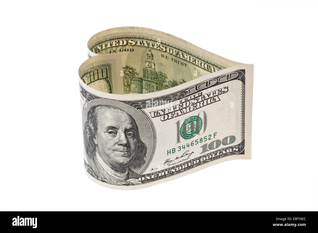 two 100 Dollar bills put together in heart shape Stock Photo