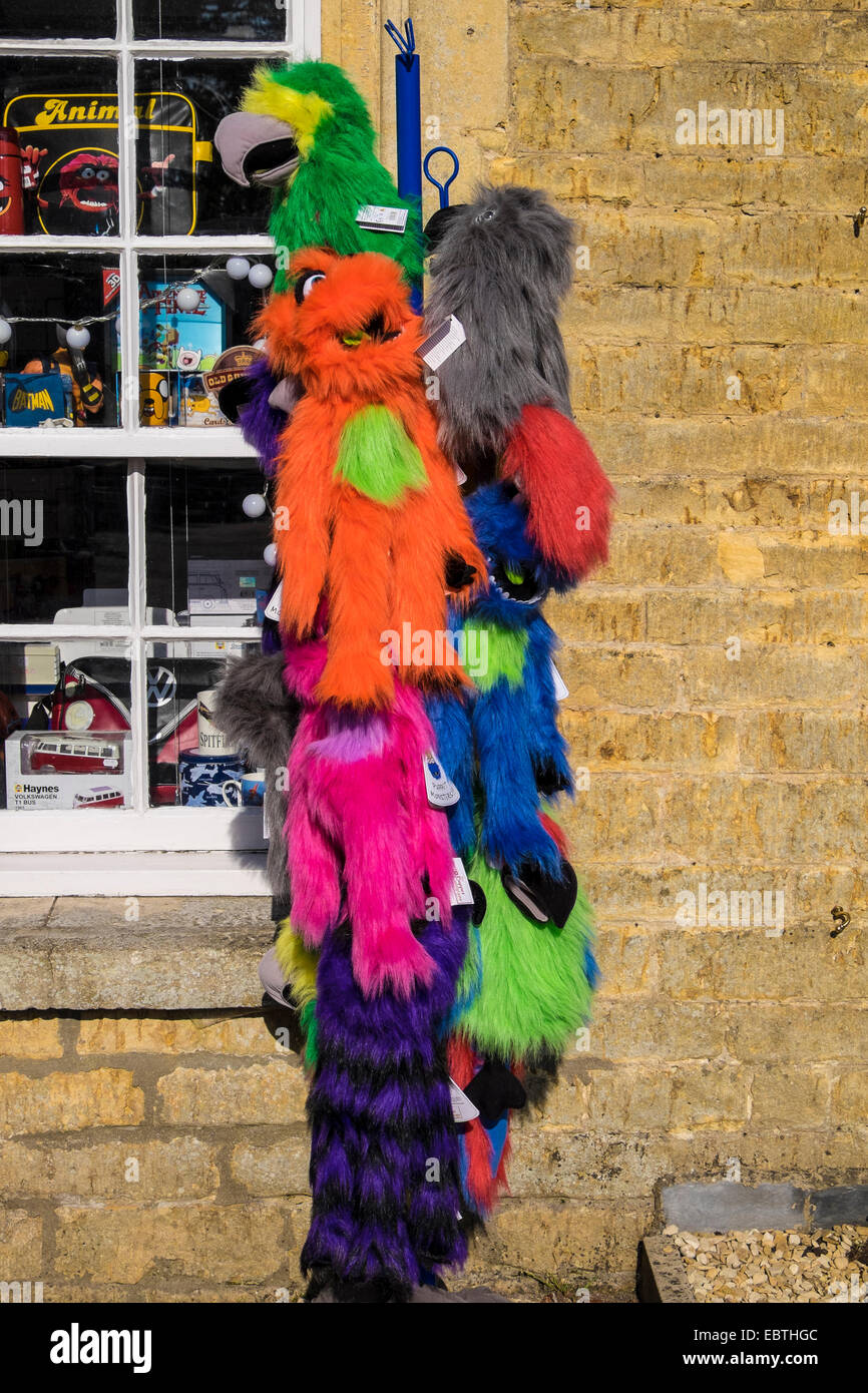 Animal puppet monsters on rack outside gift shop Bourton-on-the-Water Gloucestershire Cotswolds Stock Photo