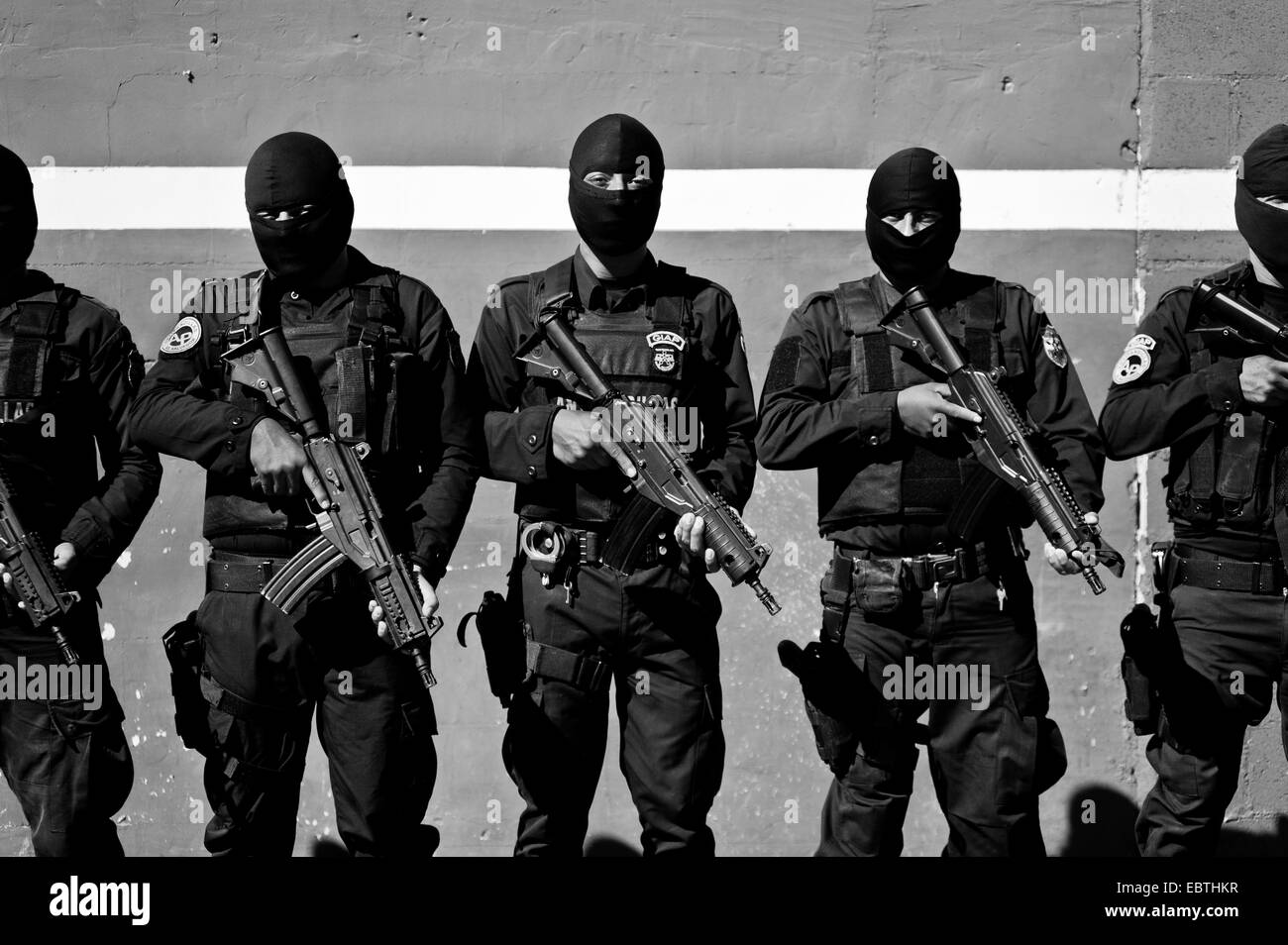 Salvadorean policemen, members of the specialized anti-gang unit (Unidad Antipandillas), receive an order on the police base before leaving for an operation in San Salvador, El Salvador, 19 December 2013. Stock Photo