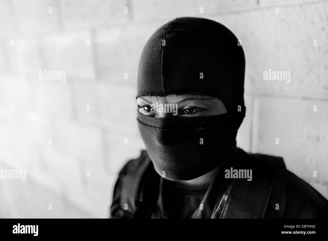 A member of the specialized Police anti-gang unit (Unidad Antipandillas) poses for a picture on the police base before leaving for an operation in San Salvador, El Salvador, 19 December 2013. Stock Photo