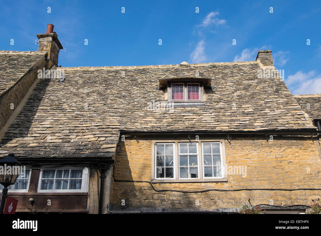 Cotswold stone roof tiles dormer window Bourton-on-the-Water Cotswolds village Gloucestershire Stock Photo