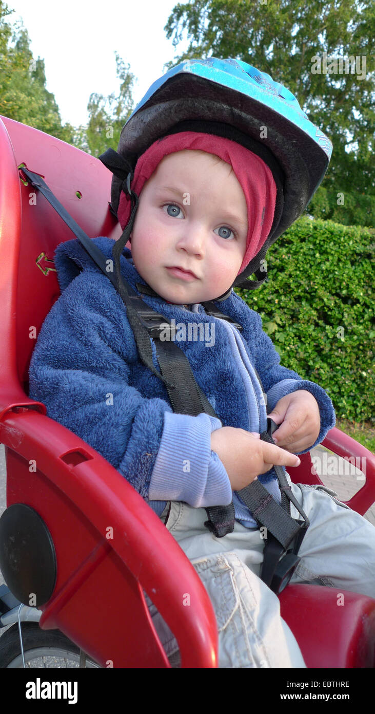 little boy on the child seat of a bike Stock Photo Alamy