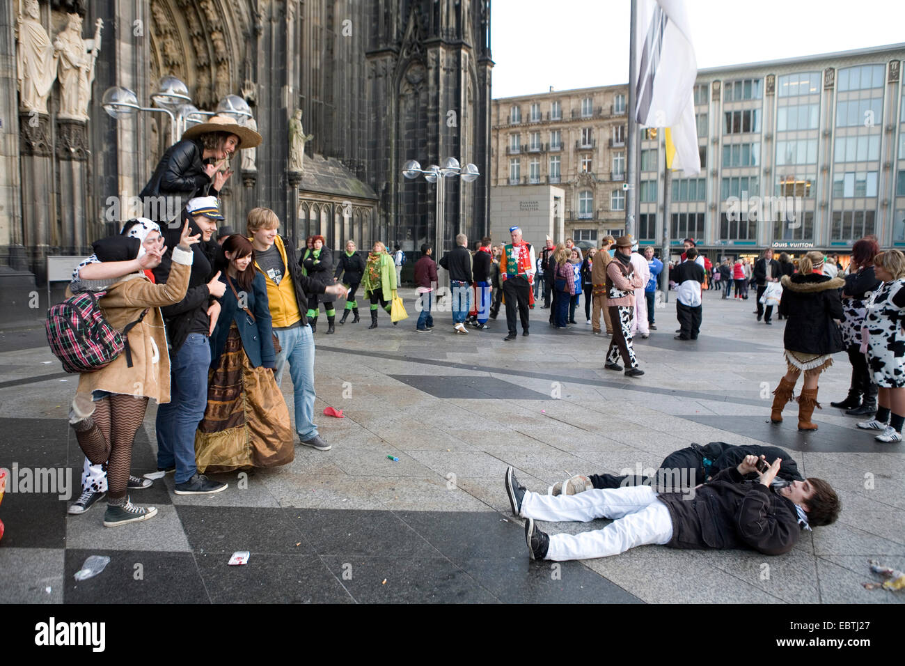 masked people in front of the Cologne Cathedral celebrating the start of the carnival season on Novemer 11, Germany, North Rhine-Westphalia, Cologne Stock Photo