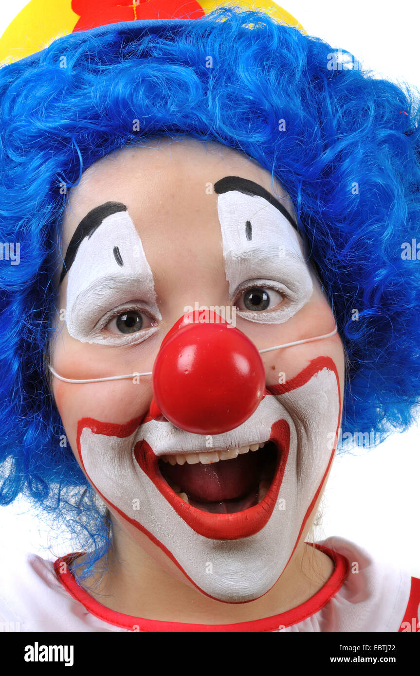 little clown with yellow hat, blue wig and false red nose Stock Photo