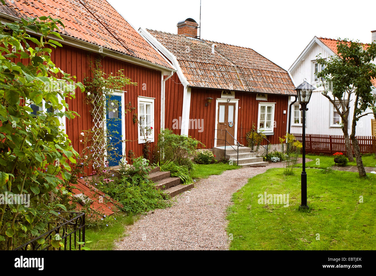 view into the frontyard of typical swedish wooden residential houses, Sweden, Smaland Stock Photo