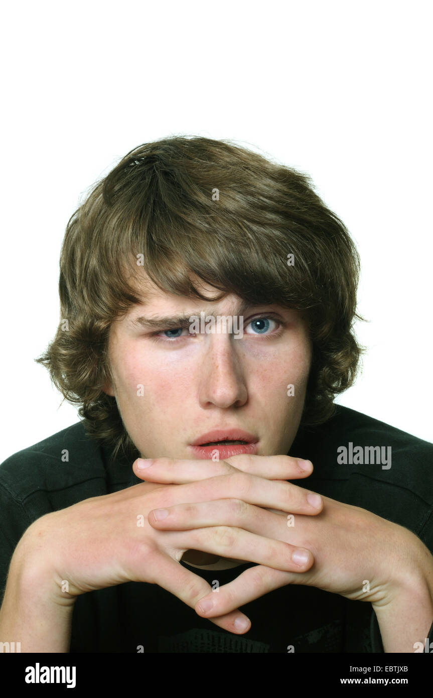 fifteen-year-old teenager looking sceptically at the camera Stock Photo