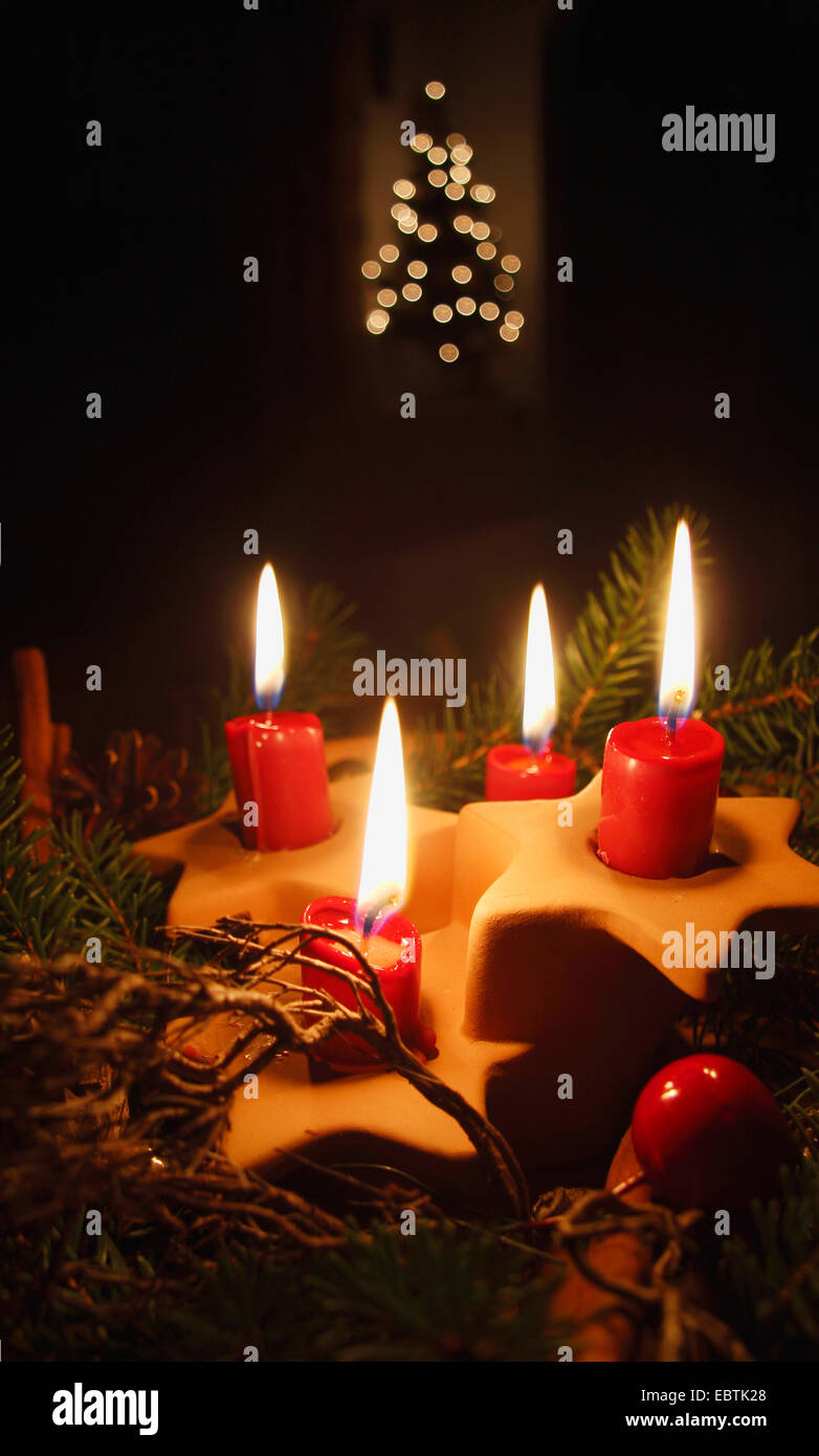 four red lighted candles Stock Photo
