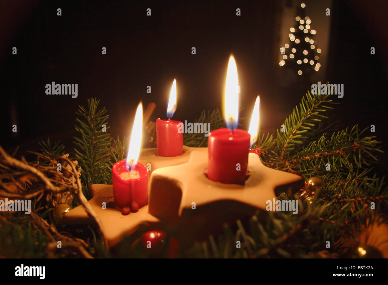 four red lighted candles Stock Photo
