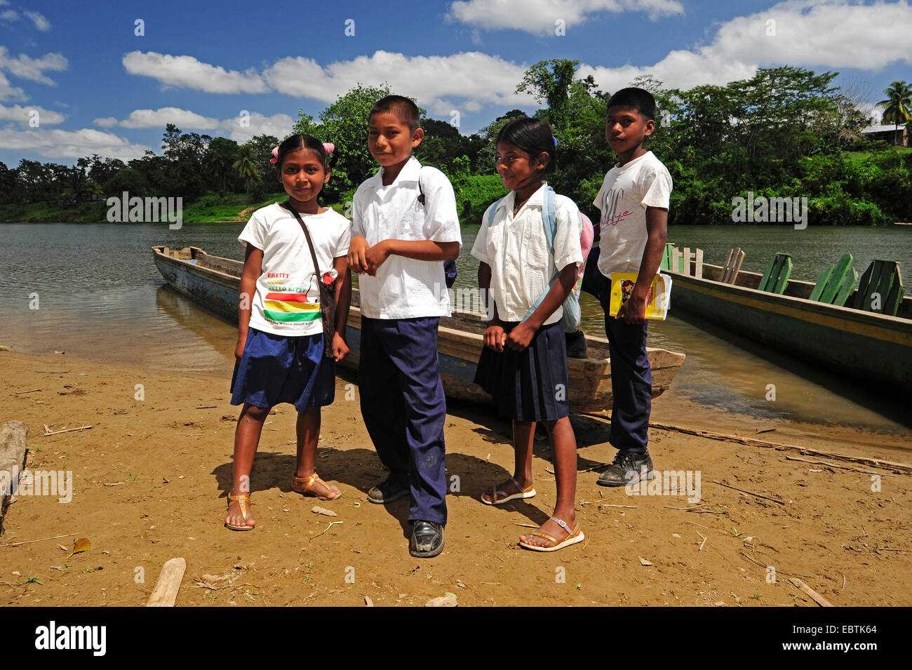 pupils of Moskito indians in front of a logboat, Honduras, La Mosquitia, Las Marias Stock Photo