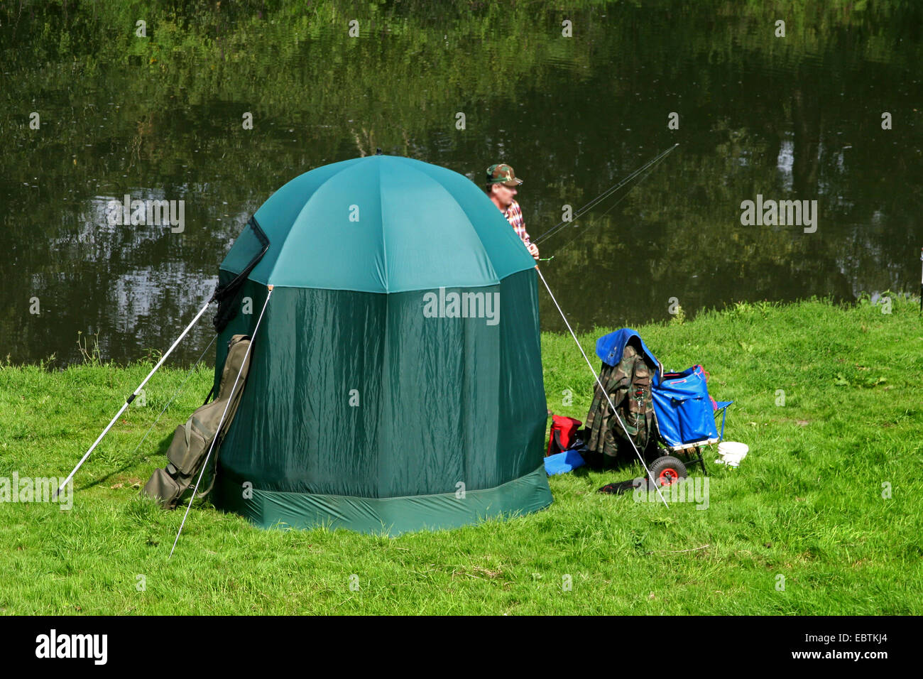 angler with tent on Lippe riverbank, Germany, North Rhine-Westphalia, Ruhr Area, Luenen Stock Photo