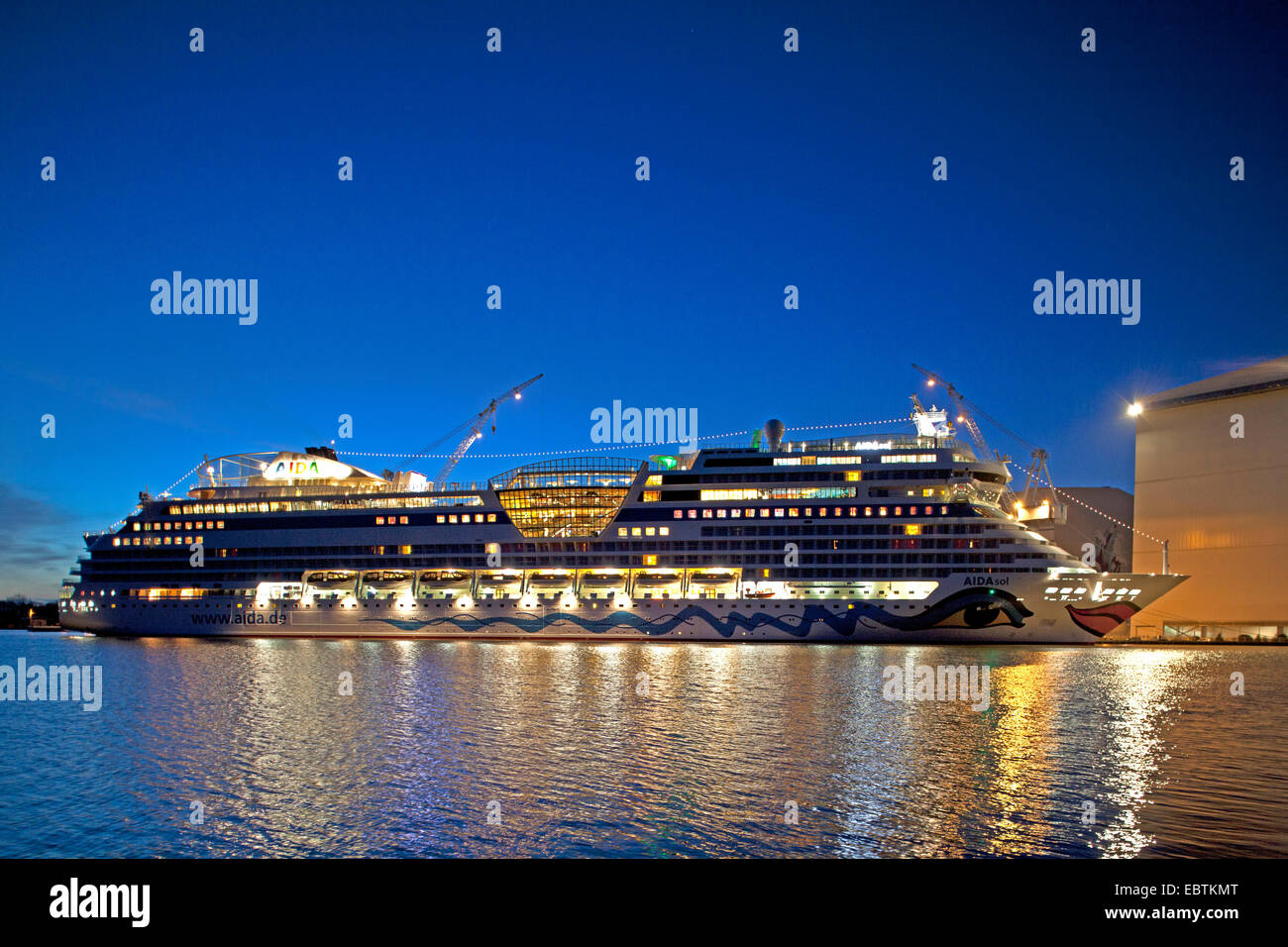 Holiday ship AIDAsol on the Harbour Meyer Werft Papenburg at night, Germany, Lower Saxony Stock Photo
