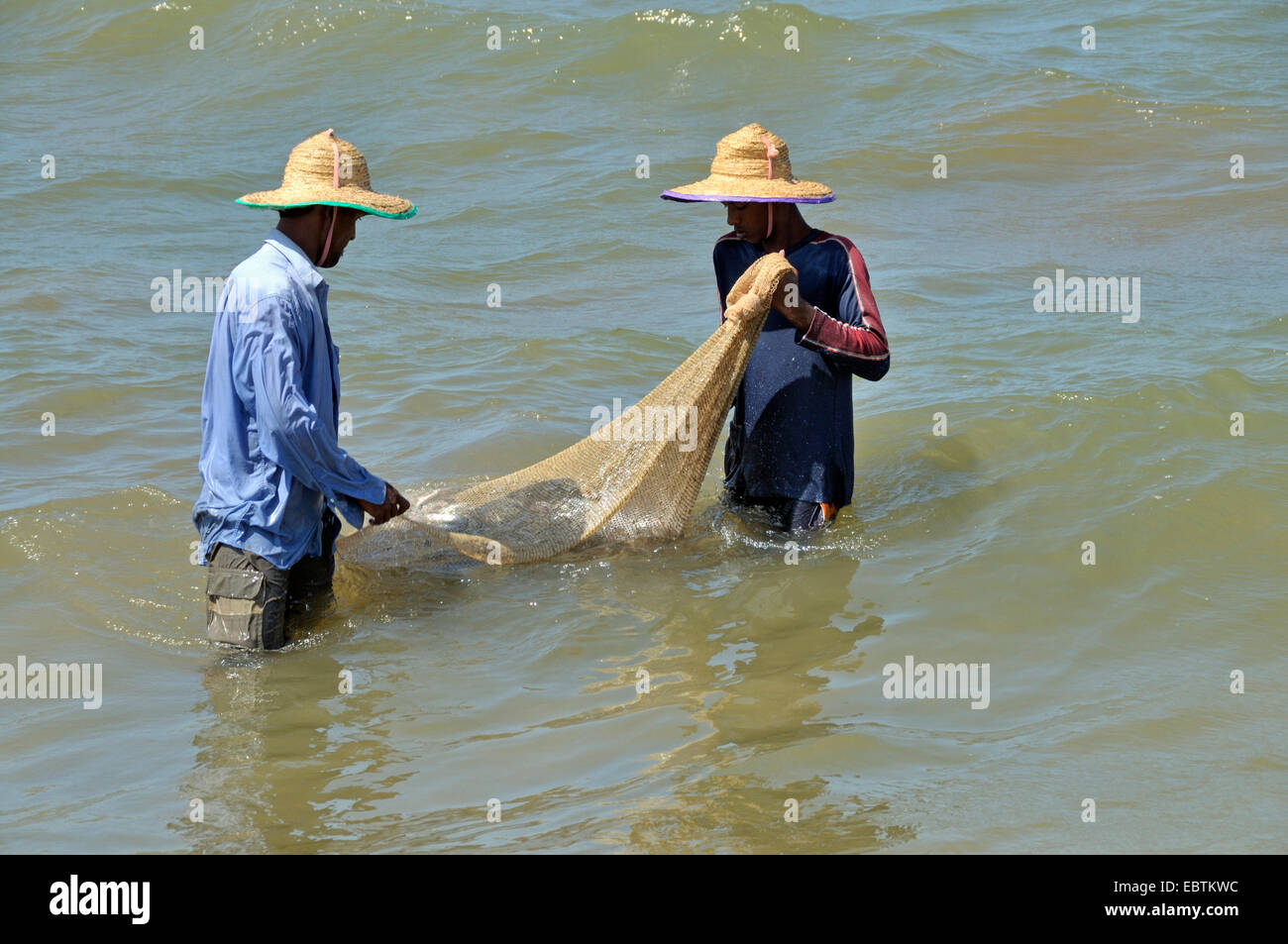 Fisherman making fishing net in hi-res stock photography and