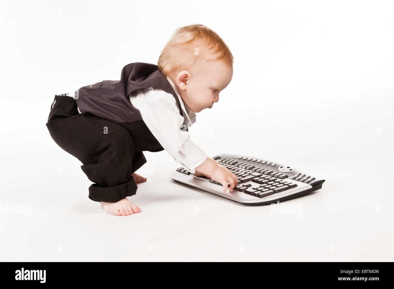 little child with computer keyboard Stock Photo - Alamy