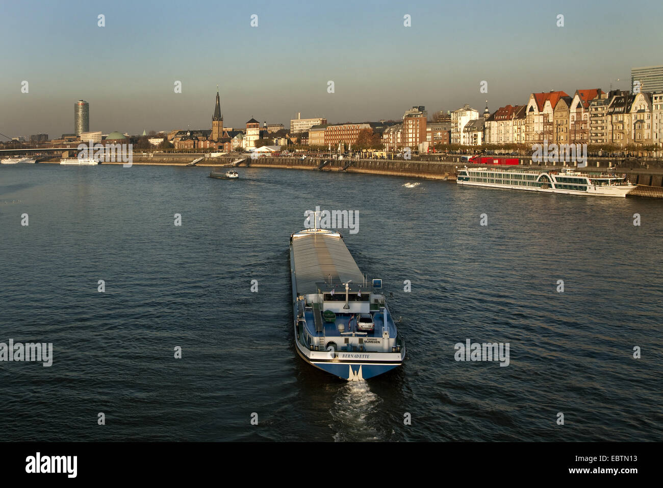 ships on Rhine river, Ergo assurance building, St. Lambertus church and castle-tower in background, Germany, North Rhine-Westphalia, Duesseldorf Stock Photo
