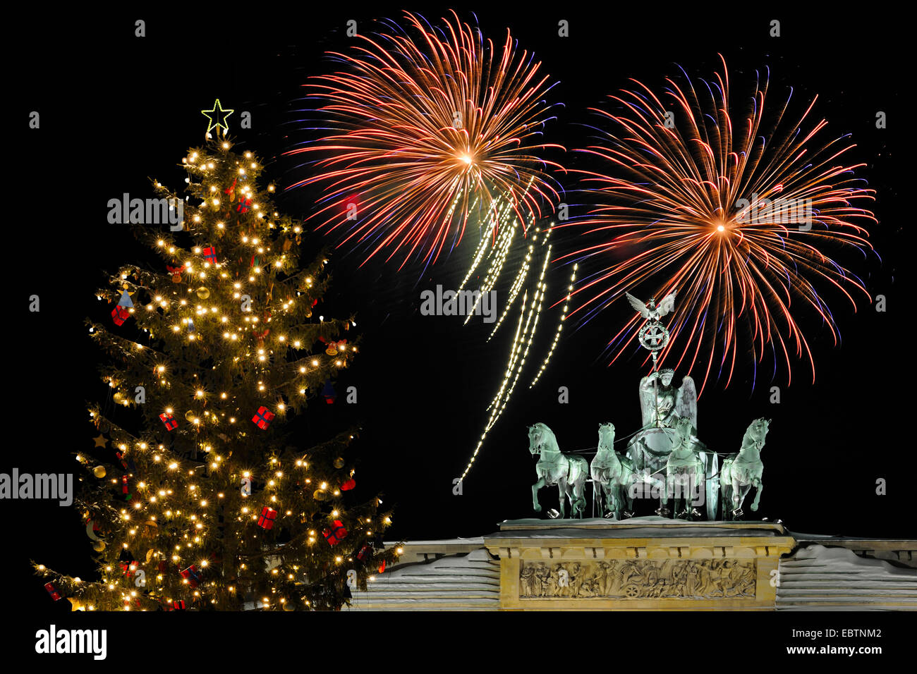 Quadriga on Brandenburg Gate, with christmas tree and fireworks