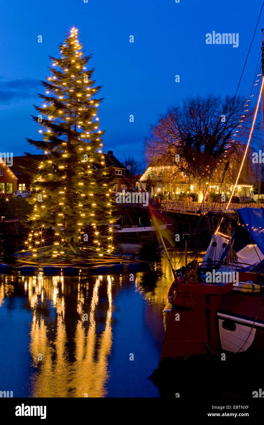 swimming christmas tree in harbour, Germany, Lower Saxony, Carolinensiel Stock Photo
