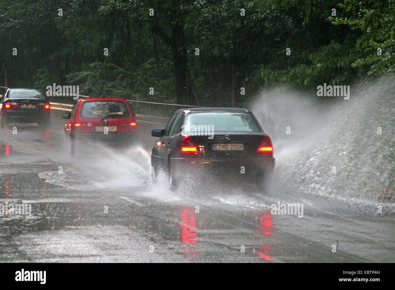 flooded street after a heavy rainshower, Germany, North Rhine-Westphalia, Ruhr Area, Essen Stock Photo