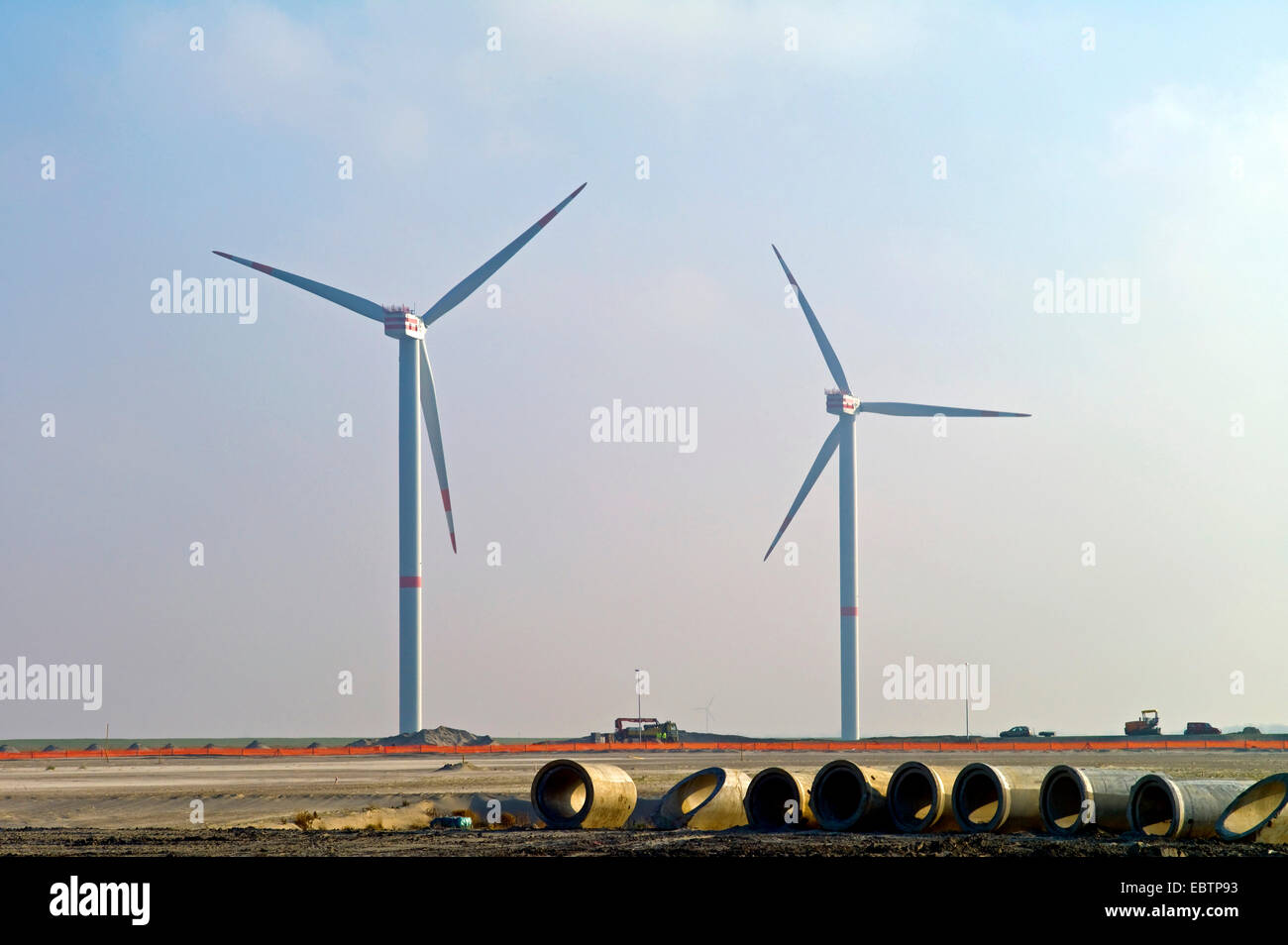 two wind power stations in industrial area, Germany, Lower Saxony, Cuxhaven Stock Photo