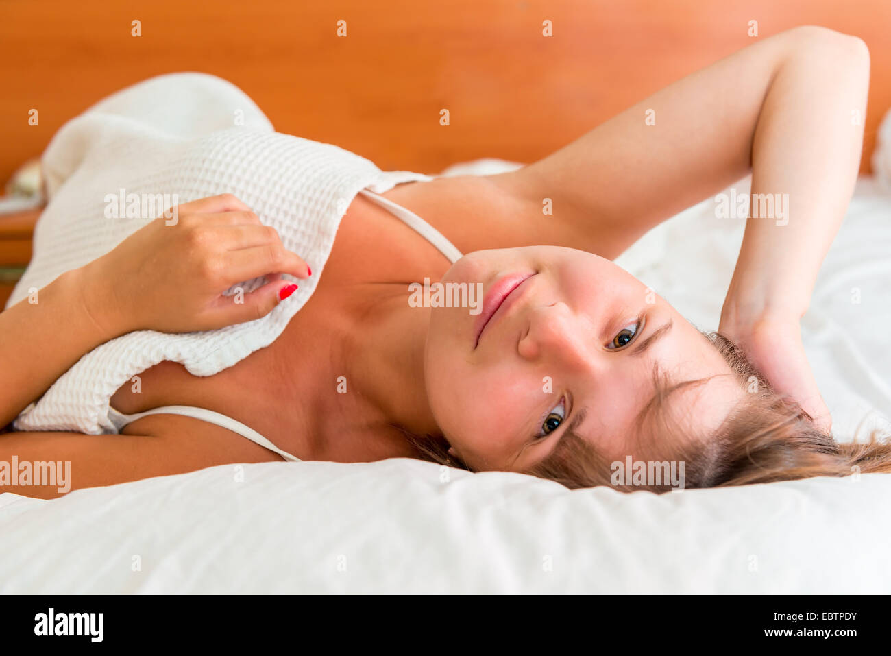 beautiful girl awoke and no hurry to get up Stock Photo