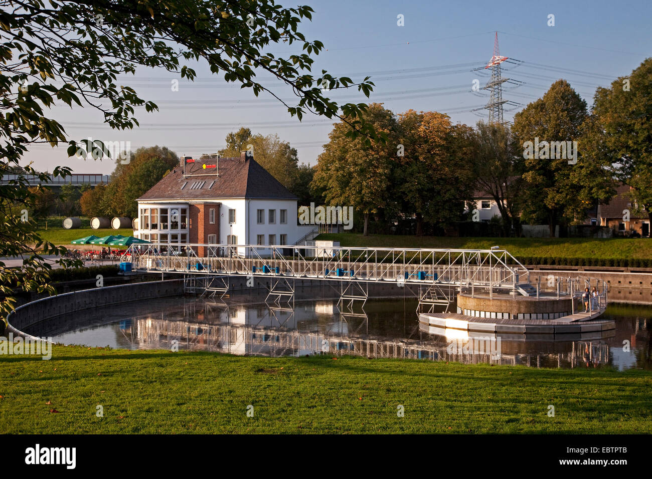 BernePark and formerly clarifying basin filled with fresh water, Germany, North Rhine-Westphalia, Ruhr Area, Bottrop Stock Photo