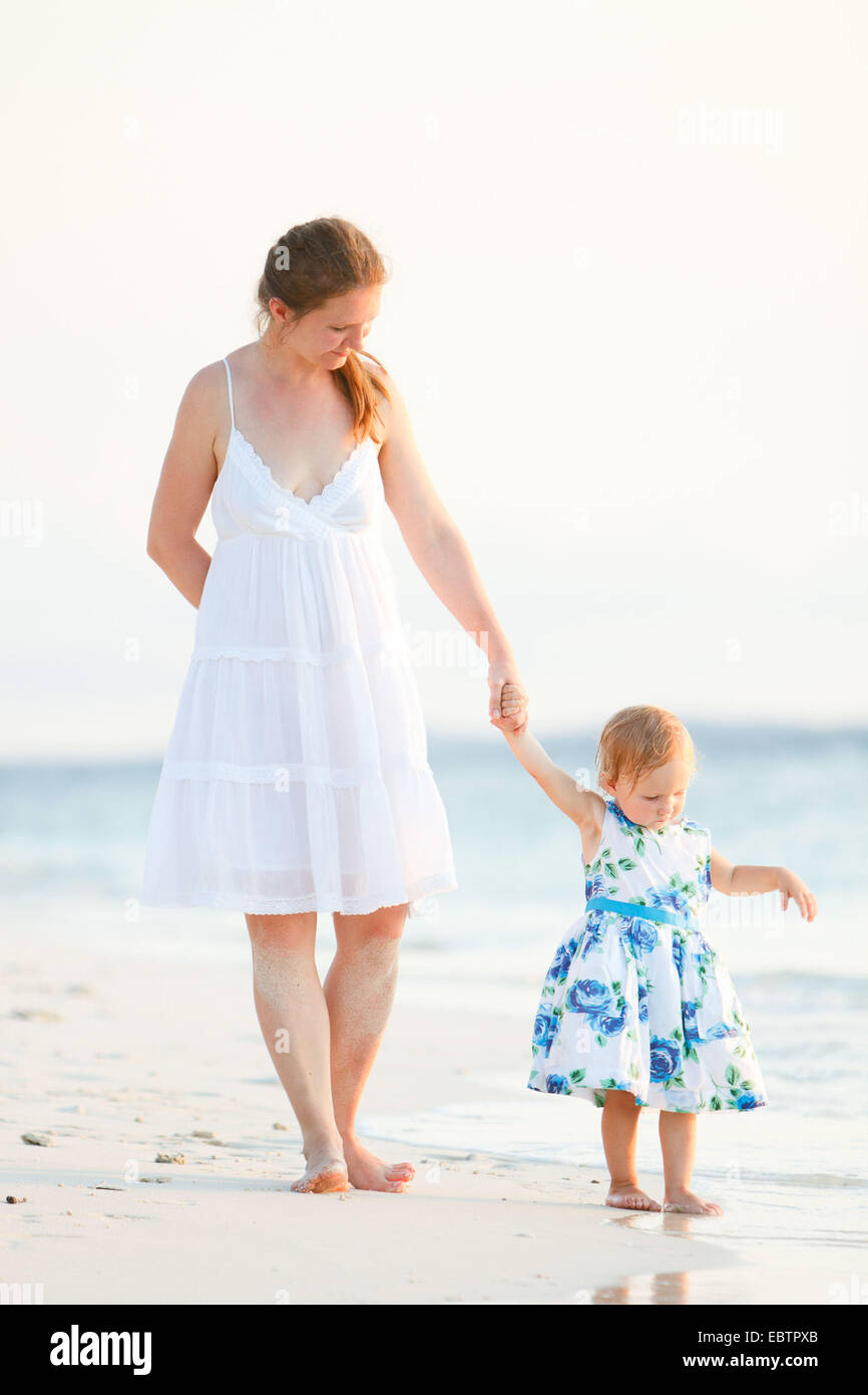 mother and daughter on tropical beach Stock Photo - Alamy