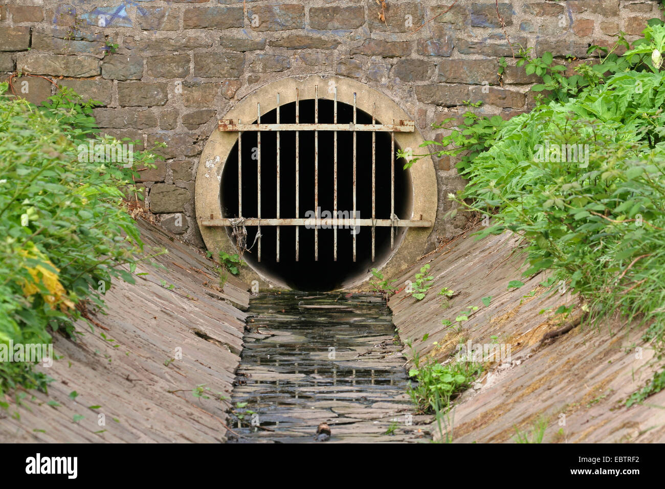 sewage drain flows in a tunnel, Germany, North Rhine-Westphalia Stock Photo