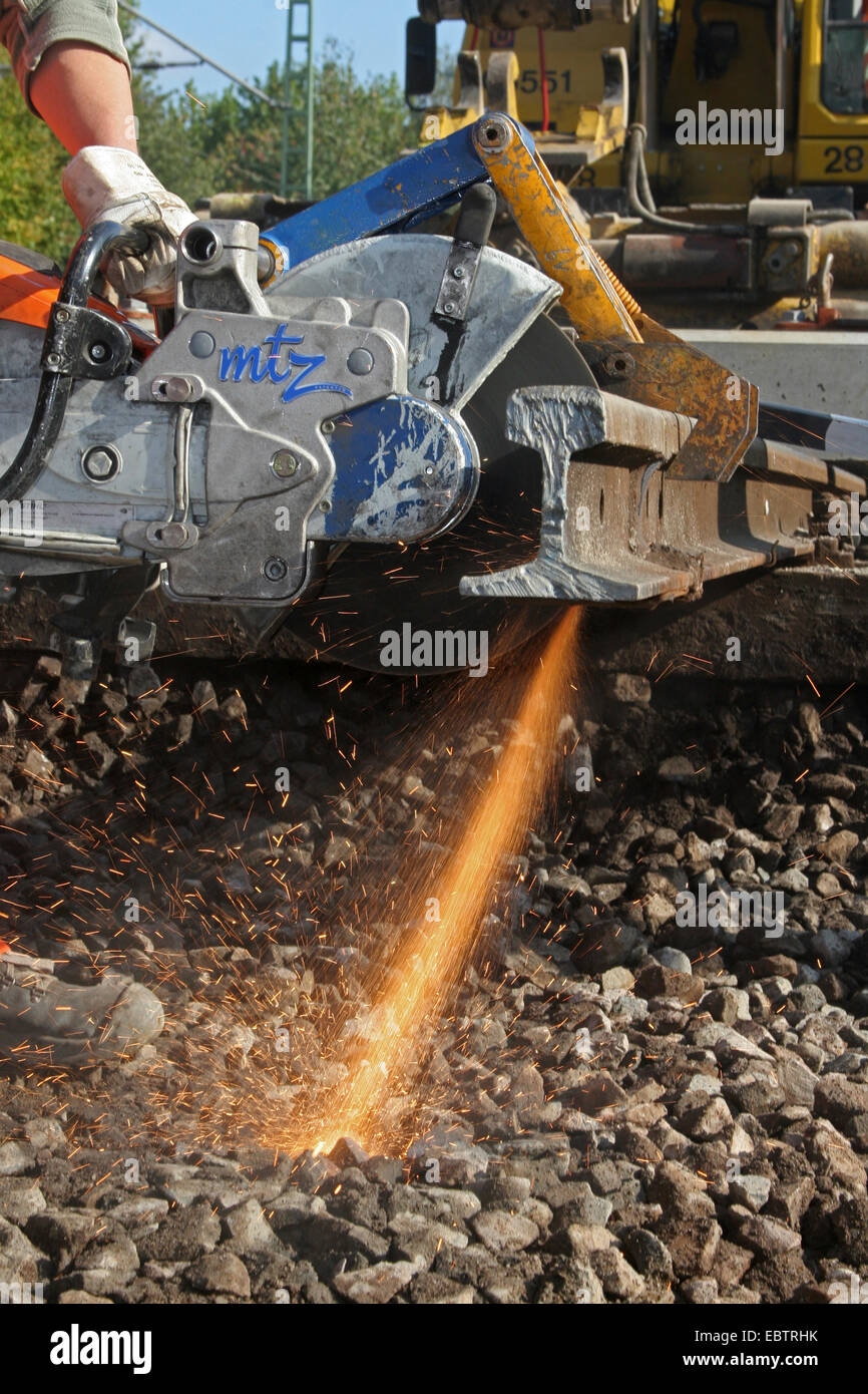 angle grinder cutting a railroad track, Germany, North Rhine-Westphalia Stock Photo