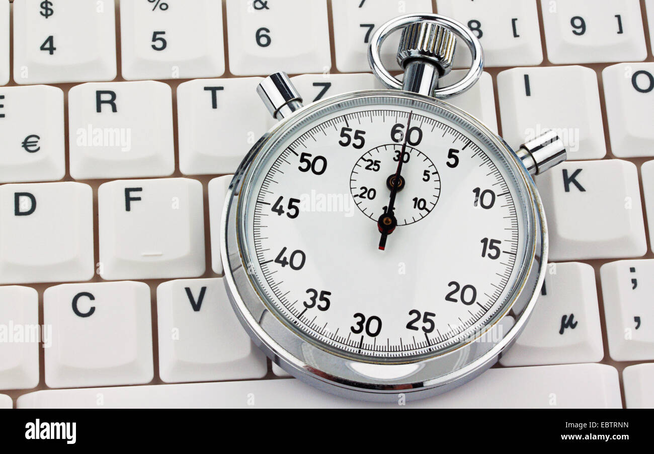 stopwatch on a computer keyboard Stock Photo