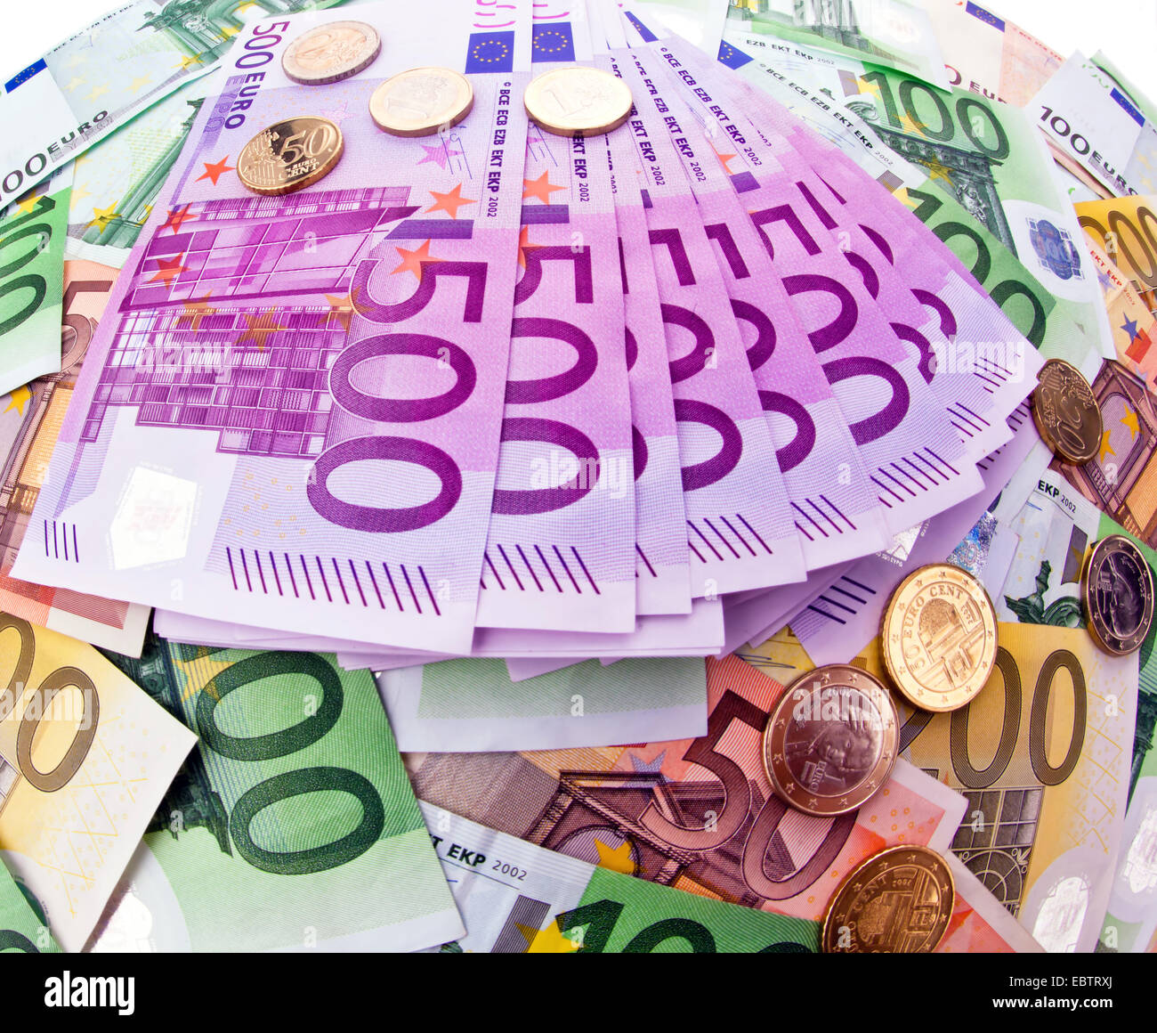 many Euro bills and coins Stock Photo