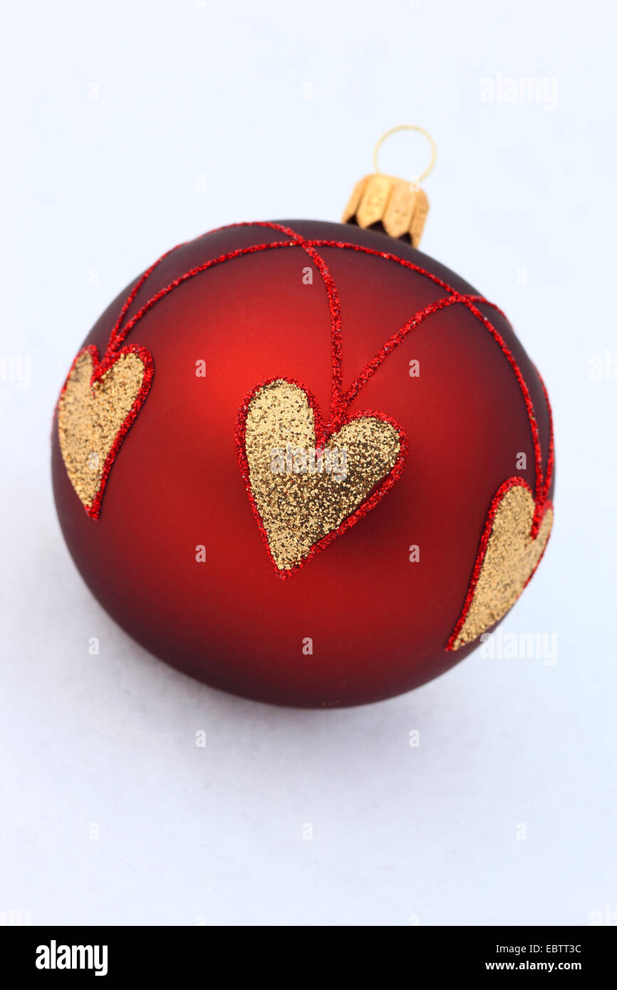 red christmas tree balls with golden hearts Stock Photo