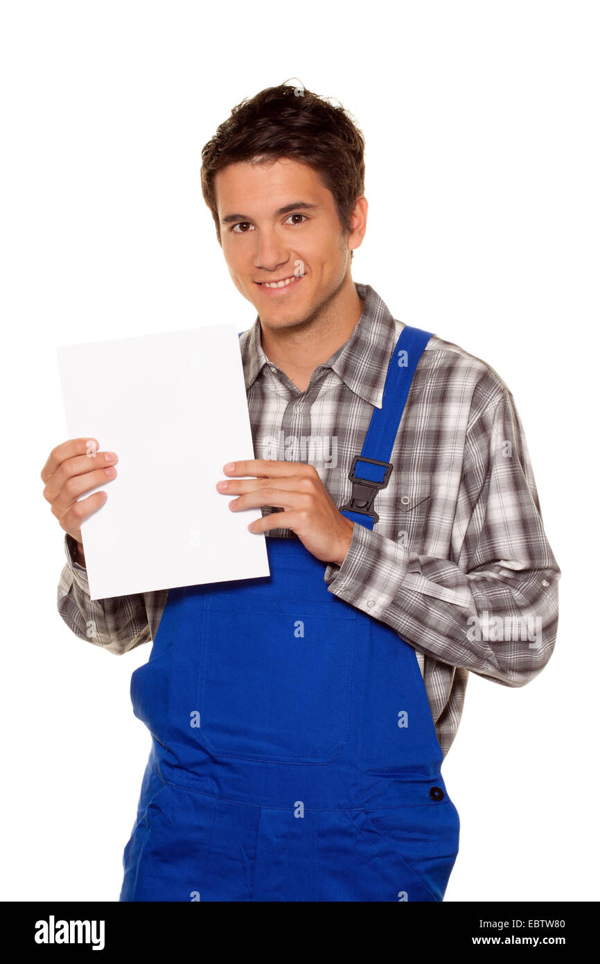 young craftsman with empty poster Stock Photo