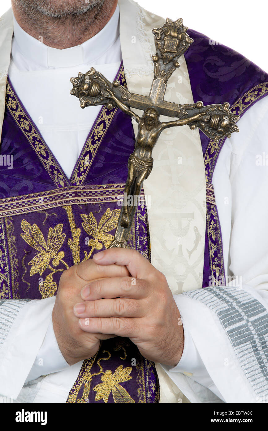 Catholic priest holding a cross Stock Photo